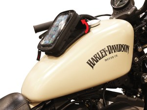 Photo showing magnetic phone holder expanded on cream colored Harley Davidson tank